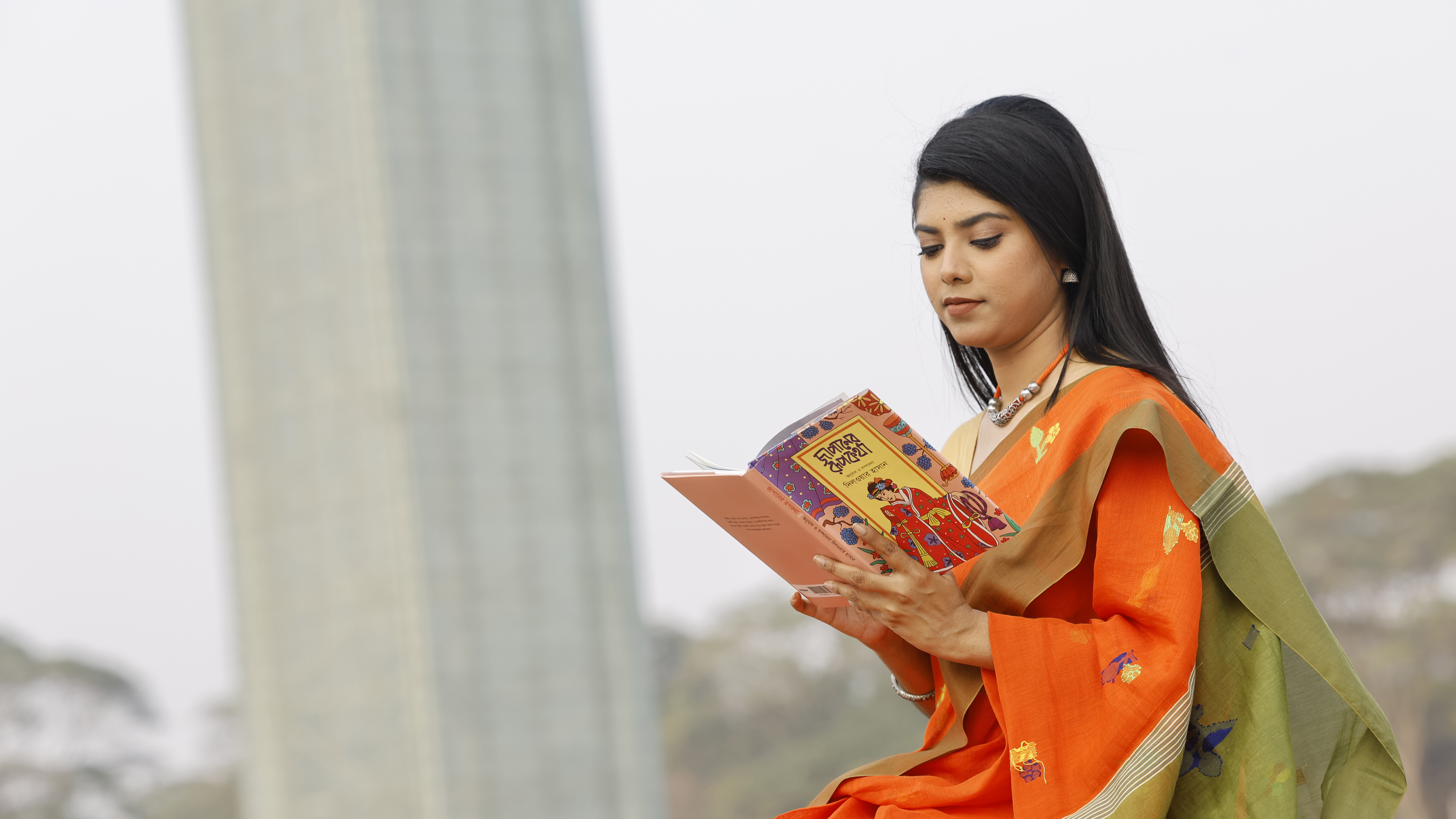 মেলায় এসে পছন্দের বই পড়ার লোভ সামলাতে পারেননি অনেকেই